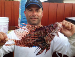 Capt. Mike Murias with the new All-Tackle lionfish
